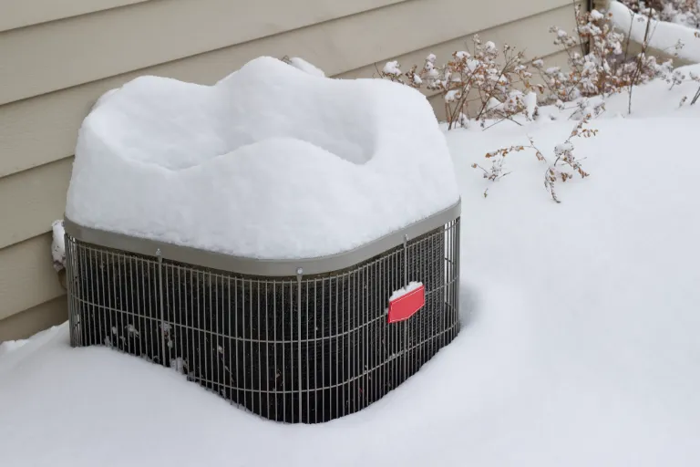 hvac unit covered in snow